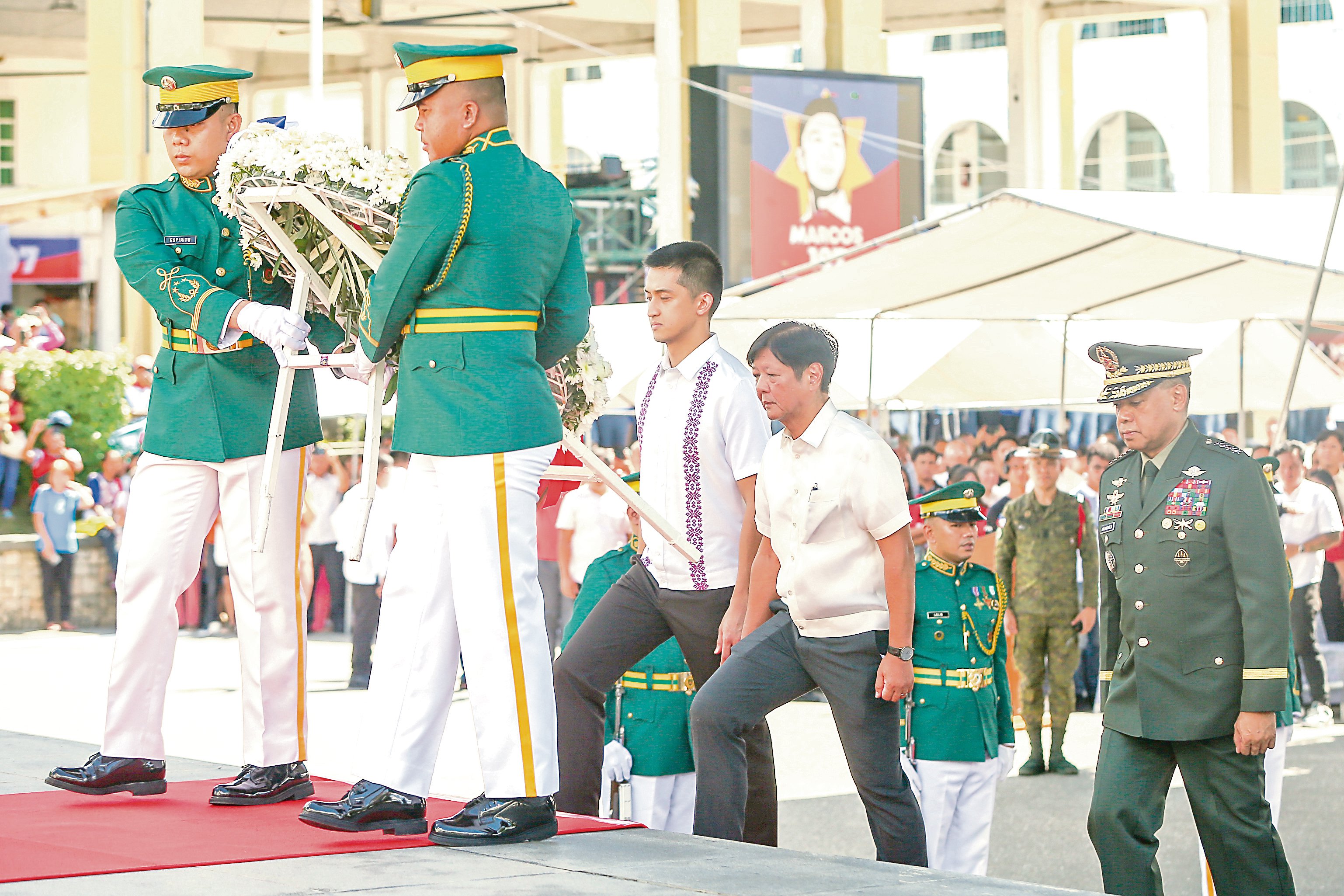 ON Wednesday, President Ferdinand Marcos Jr. leads a poignant 
wreath-laying ceremony at the Marcos Monument in Batac City, Ilocos Norte, honoring his father, former President Ferdinand E. Marcos Sr., on what would have been his 107th birthday. The solemn tribute, marked by a moment of reflection and respect, was attended by Armed Forces of the Philippines chief Gen. Romeo S. Brawner Jr. and Ilocos Norte Governor Matthew Manotoc.